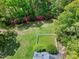 Aerial view of backyard showing green lawn and a white picket fenced area at 8120 Stillbreeze Dr, Fuquay Varina, NC 27526