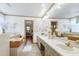Bright bathroom features a double sink vanity, soaking tub, and views to another room at 8120 Stillbreeze Dr, Fuquay Varina, NC 27526