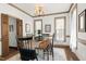 Formal dining room featuring classic decor, neutral walls, and ample natural light at 8120 Stillbreeze Dr, Fuquay Varina, NC 27526