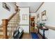Elegant foyer with hardwood floors, staircase, and decorative accents creates a welcoming atmosphere at 8120 Stillbreeze Dr, Fuquay Varina, NC 27526