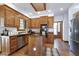 Well-equipped kitchen featuring wood cabinets, stainless appliances, and granite countertops at 8120 Stillbreeze Dr, Fuquay Varina, NC 27526