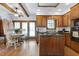 Large kitchen showcasing a center island, wood cabinets and hardwood floors at 8120 Stillbreeze Dr, Fuquay Varina, NC 27526