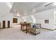 Open living area with vaulted ceilings, carpet, and a staircase at 8120 Stillbreeze Dr, Fuquay Varina, NC 27526