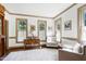 Bright living room features hardwood floors and ample natural light at 8120 Stillbreeze Dr, Fuquay Varina, NC 27526