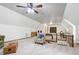 Open living area with vaulted ceilings, carpet, and a staircase at 8120 Stillbreeze Dr, Fuquay Varina, NC 27526