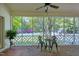 Screened porch with brick floors, a ceiling fan, outdoor seating, and views of the backyard at 8120 Stillbreeze Dr, Fuquay Varina, NC 27526