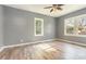 Bright bedroom with wood-look floors and two windows providing natural light at 813 S Franklin St, Rocky Mount, NC 27803