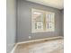 Cozy bedroom with wood-look floors and ample natural light at 813 S Franklin St, Rocky Mount, NC 27803