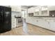 Charming kitchen featuring granite countertops, stainless steel appliances, and white cabinets at 813 S Franklin St, Rocky Mount, NC 27803