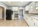 Updated kitchen featuring granite countertops, stainless steel appliances, and wood-look floors at 813 S Franklin St, Rocky Mount, NC 27803