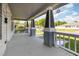 Covered porch featuring stone pillars, white railings, and a spacious area for outdoor seating at 813 S Franklin St, Rocky Mount, NC 27803