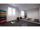 Bright exercise room with yoga mats, exercise balls and large mirrors at 8413 Portmarnock Ct, Wake Forest, NC 27587