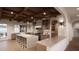 Well-appointed kitchen with large island, sleek countertops, modern appliances, and hardwood floors at 8413 Portmarnock Ct, Wake Forest, NC 27587