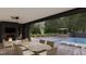 Outdoor space with a pool, patio, fireplace and dining area perfect for entertainment at 8413 Portmarnock Ct, Wake Forest, NC 27587
