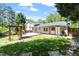 The lovely backyard with a pergola, well-maintained lawn, and an outdoor deck offers a peaceful retreat at 904 Emory Ln, Raleigh, NC 27609