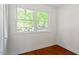 Bright bedroom with hardwood floors, a double window, and a closet, providing a comfortable and airy feel at 904 Emory Ln, Raleigh, NC 27609