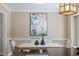 Dining room with modern decor, stylish lighting, and a comfortable seating arrangement at 904 Emory Ln, Raleigh, NC 27609