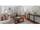 Cozy living room with hardwood floors, neutral-toned furniture, and stylish decor at 904 Emory Ln, Raleigh, NC 27609