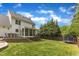 Expansive backyard with a deck, trampoline, and lush greenery offers a perfect outdoor retreat at 1005 Thorncroft Ln, Apex, NC 27502