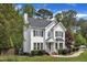 Beautiful two-story house with a manicured lawn and lush landscaping at 1005 Thorncroft Ln, Apex, NC 27502