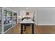 Spacious kitchen with an island and breakfast bar and an adjacent screened-in porch at 1005 Thorncroft Ln, Apex, NC 27502