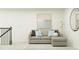 The living room includes a gray sectional sofa, accent pillows, and modern decor at 10060 Regal Dr # 17, Angier, NC 27501
