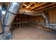 Unfinished attic area featuring exposed wooden beams, a light fixture, and ductwork at 1007 Fairhaven Dr, Mebane, NC 27302