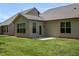 Beautiful backyard showcasing a well-maintained lawn, patio, and the home's exterior at 1007 Fairhaven Dr, Mebane, NC 27302