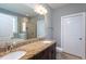 Bathroom with double sink vanity and tile surround shower at 1007 Fairhaven Dr, Mebane, NC 27302