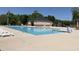 Outdoor community swimming pool with ample lounge chairs for residents to enjoy at 1007 Fairhaven Dr, Mebane, NC 27302