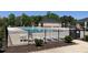 Community pool offers lounge chairs and tables, plus a changing room and nearby accessible parking at 1007 Fairhaven Dr, Mebane, NC 27302
