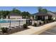 View of the community pool and amenities, including a covered cabana and accessible entrance at 1007 Fairhaven Dr, Mebane, NC 27302