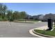 View of new homes and landscaping in a well-maintained community with paved parking and scenic trees at 1007 Fairhaven Dr, Mebane, NC 27302