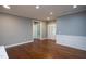 Bright living room featuring hardwood floors, gray walls, and white trim at 1007 Fairhaven Dr, Mebane, NC 27302