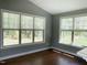 Light-filled living room with large windows offering scenic views at 1007 Fairhaven Dr, Mebane, NC 27302