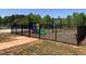 Fenced playground with colorful play structure and swing set on mulched ground at 1007 Fairhaven Dr, Mebane, NC 27302