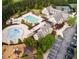 Aerial view of community pool, water park, tennis courts, playground, and parking showcases recreational amenities at 1009 Linenhall Way, Wake Forest, NC 27587