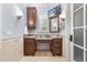 Elegant bathroom features a vanity, marble countertops, shuttered window, and stylish decor at 1009 Linenhall Way, Wake Forest, NC 27587