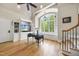 Bright home office with a large window, built-in shelving, and hardwood floors at 1009 Linenhall Way, Wake Forest, NC 27587