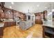 Gourmet kitchen with custom cabinetry, stainless steel appliances, and a spacious island at 1009 Linenhall Way, Wake Forest, NC 27587