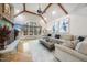 Spacious living room with vaulted ceilings, stone fireplace, large window, and comfortable seating at 1009 Linenhall Way, Wake Forest, NC 27587