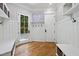 Charming mud room boasting custom shelving, coat hooks, and convenient bench seating at 1009 Linenhall Way, Wake Forest, NC 27587