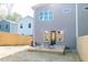 Backyard showcasing a wooden deck, modern exterior, and a privacy fence at 109 S Plum St, Durham, NC 27703