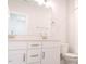 Bright bathroom featuring dual sinks, quartz counters, and a shower at 109 S Plum St, Durham, NC 27703