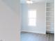 Light-filled room features hardwood floors, built-in bookshelves, and a ceiling fan at 109 S Plum St, Durham, NC 27703