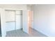 Bright bedroom with hardwood floors, closet and door open to next room at 109 S Plum St, Durham, NC 27703