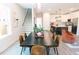 Bright dining room with modern lighting, stylish decor, and seamless flow into the kitchen and living areas at 109 S Plum St, Durham, NC 27703