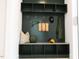 Mudroom area with a dark built-in shelf and bench, accessories, and hooks at 109 S Plum St, Durham, NC 27703