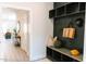 Mudroom area with a dark built-in shelf and bench next to an open doorway at 109 S Plum St, Durham, NC 27703