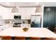 Charming kitchen features a center island with seating, modern appliances, and lots of counterspace at 109 S Plum St, Durham, NC 27703